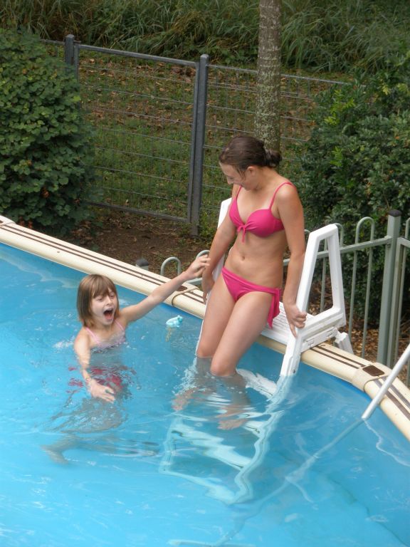 Natalie jumped in the pool too and promptly got dunked by her sister ! (they didn't stay in there too long, ...and straight into a hot shower afterwards !!