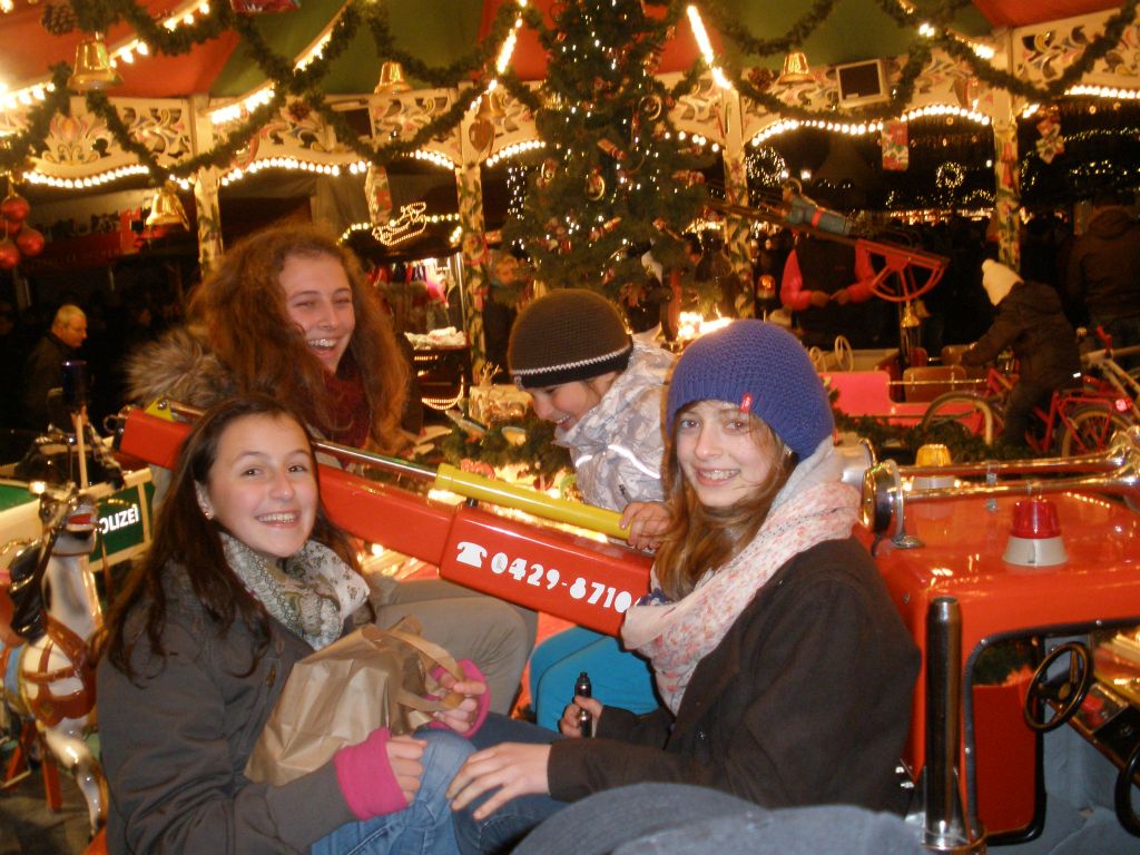 My girls and Moike's girls on the carousel at the Aachener Weihnachtsmarkt